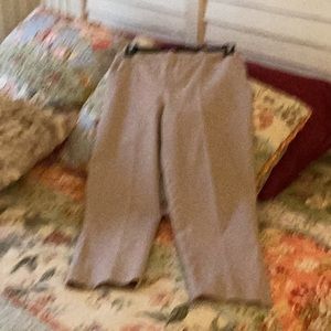 Tan pants with slit on bottom legs and front pockets